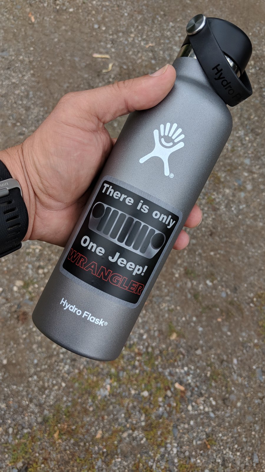 grey hydro flask with stickers